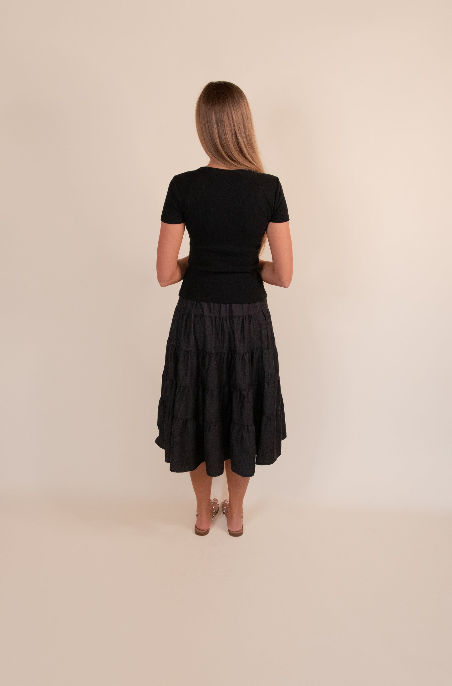 The Kenna Tiered Midi Skirt in Washed Black Denim