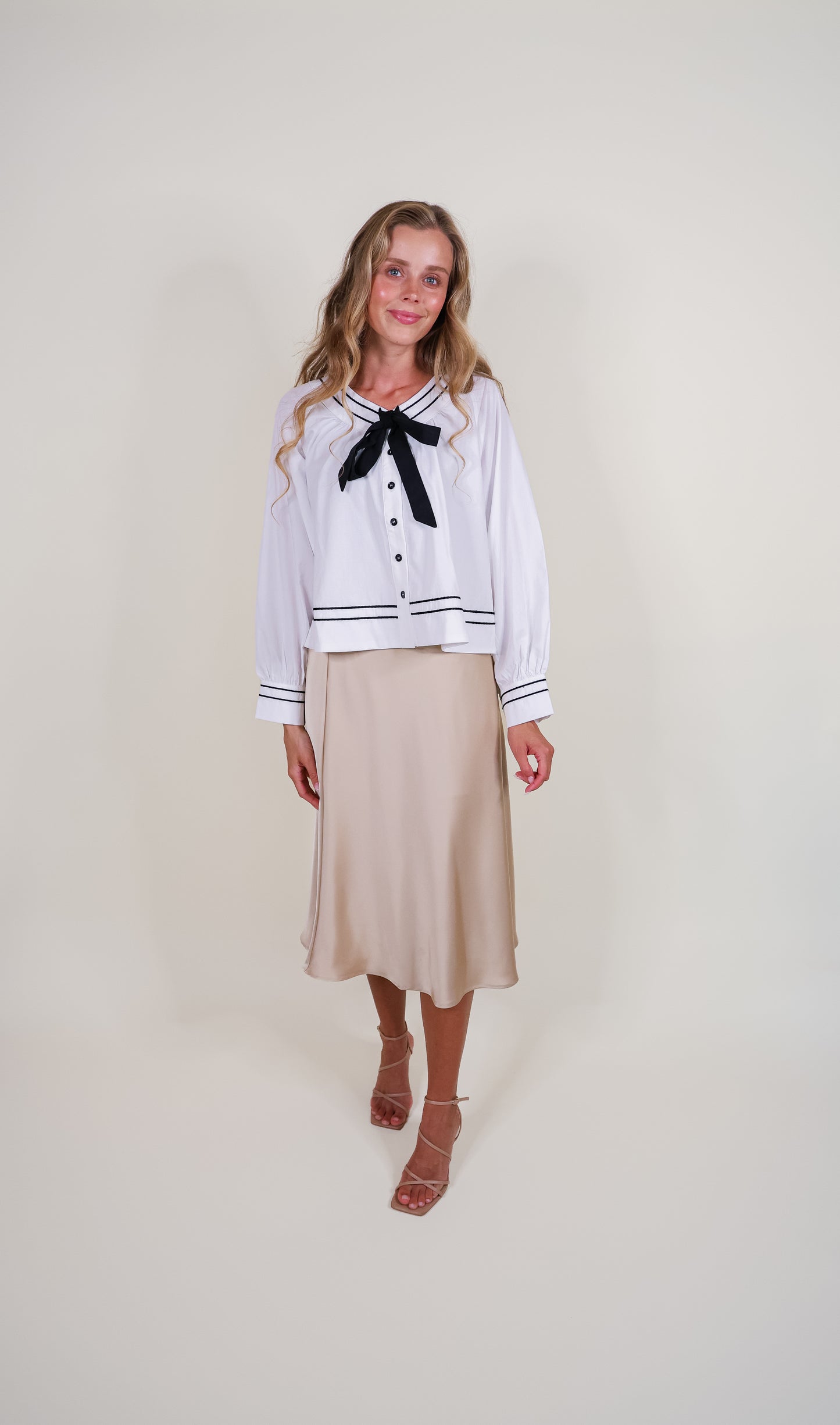 The Sienna Bow Babydoll Blouse in Ivory & Black