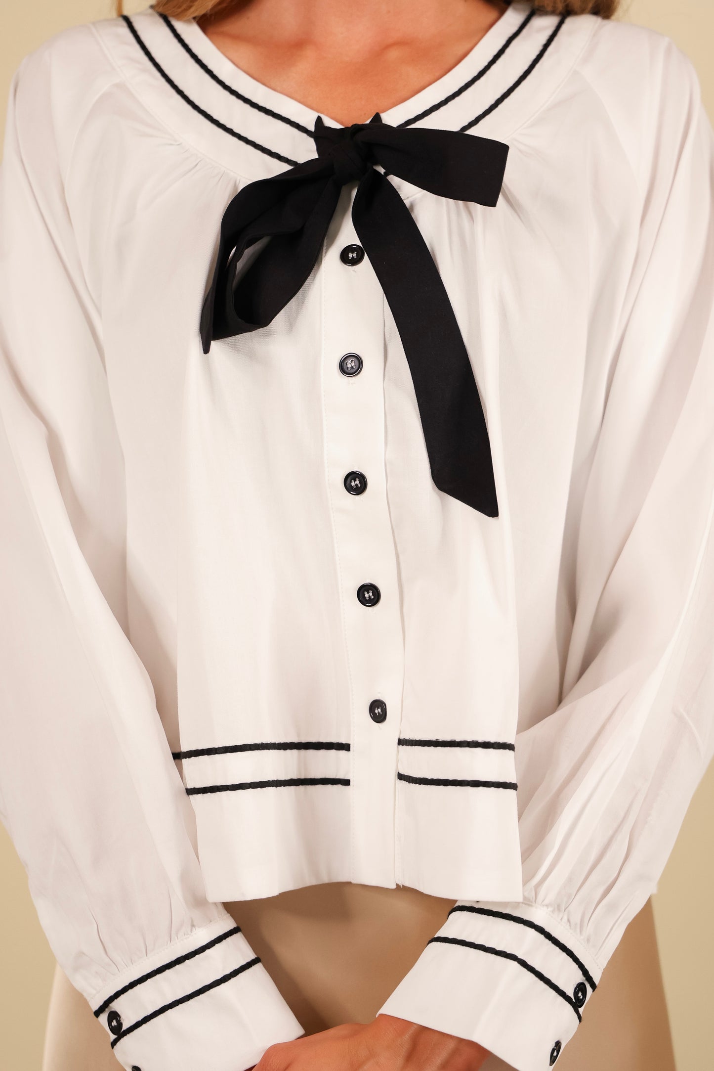 The Sienna Bow Babydoll Blouse in Ivory & Black