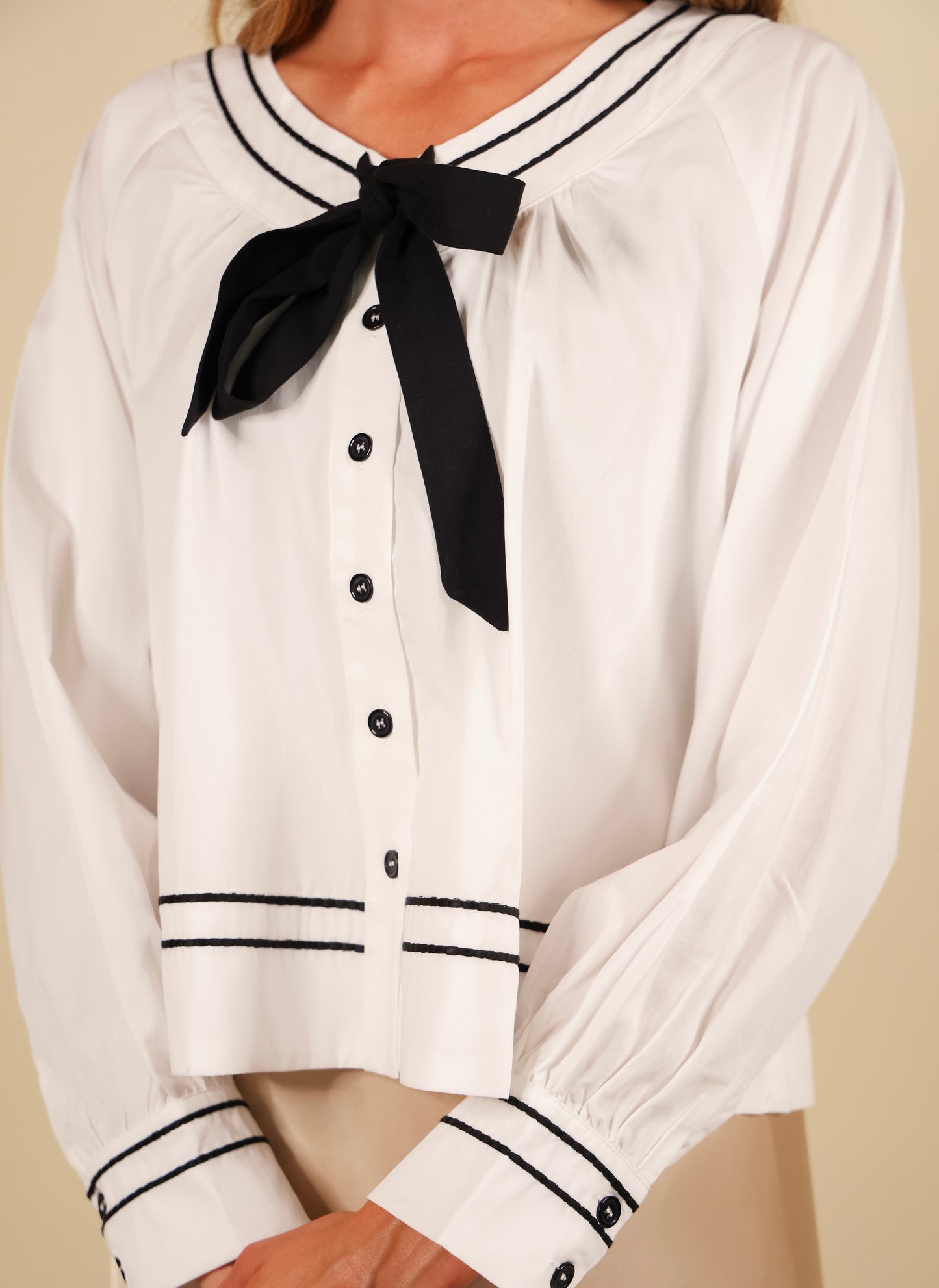 The Sienna Bow Babydoll Blouse in Ivory & Black