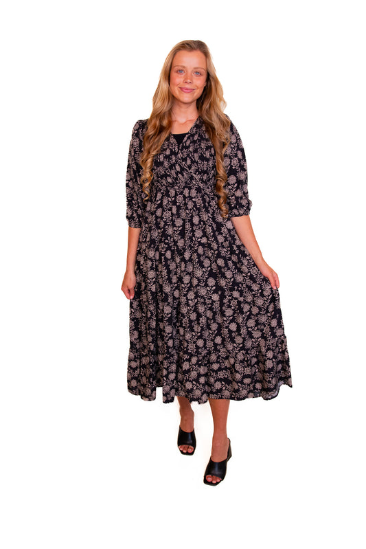 The Kelli Smocked Wrap Midi in Black Fall Floral