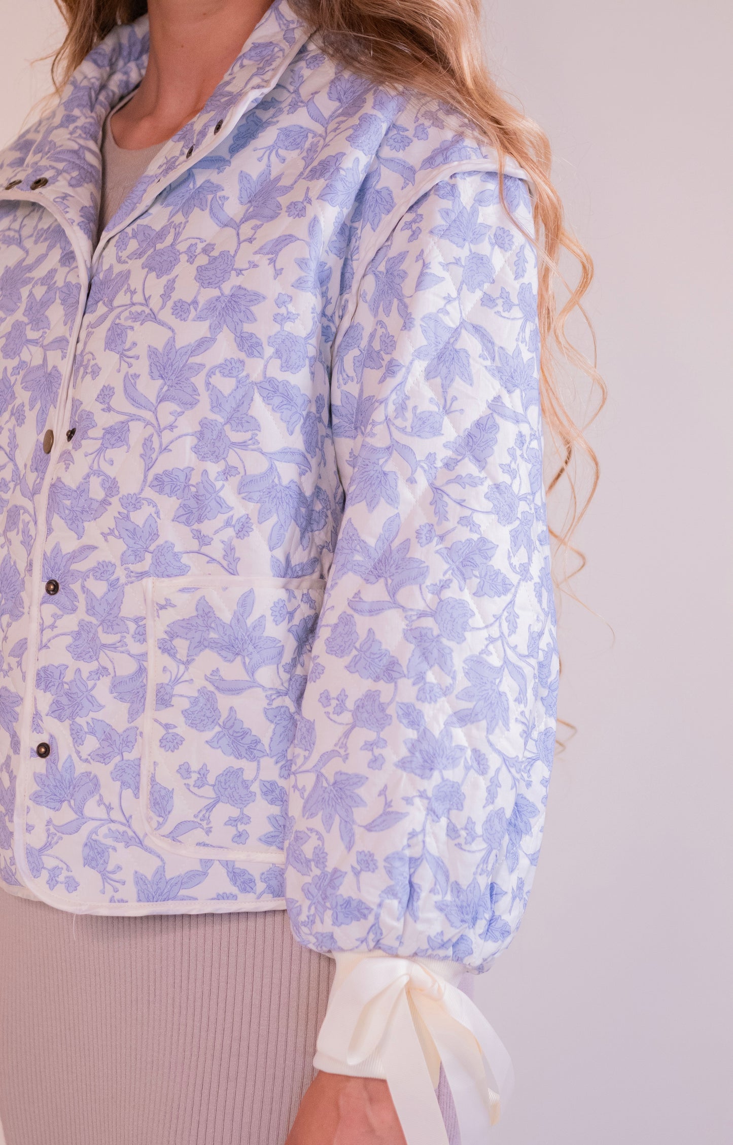 RESTOCKED - The Lorelei Quilted Bow Jacket in Blue Floral