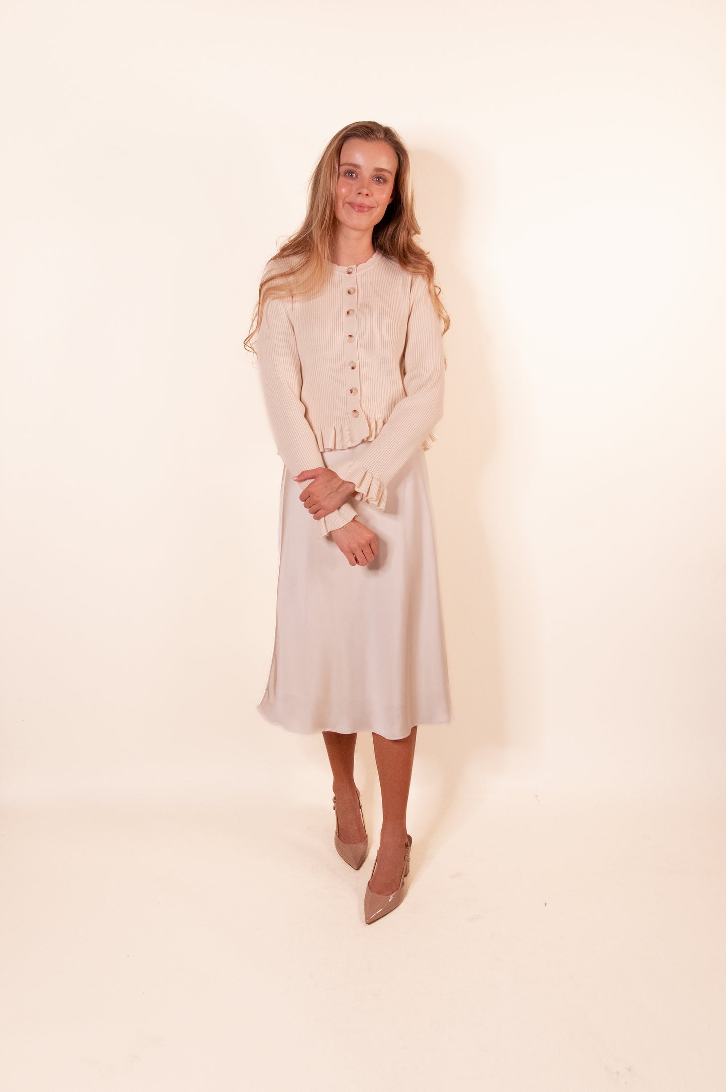 The Cora Ribbed Ruffle Cardigan in Cream