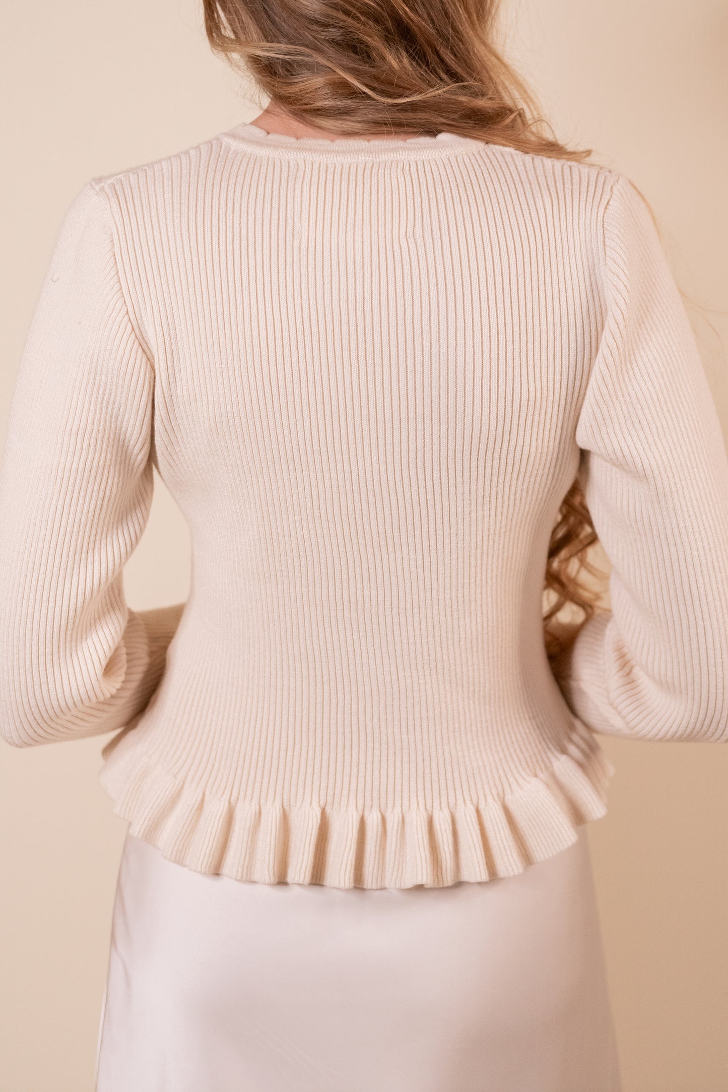 The Cora Ribbed Ruffle Cardigan in Cream