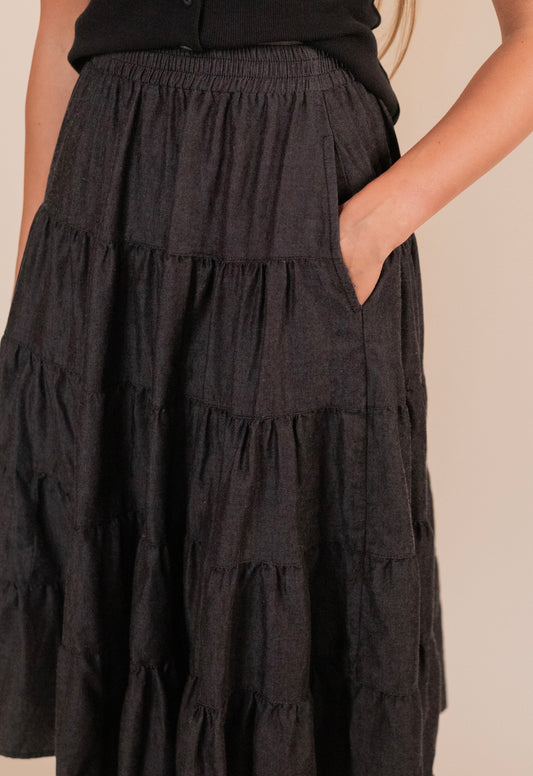 The Kenna Tiered Midi Skirt in Washed Black Denim