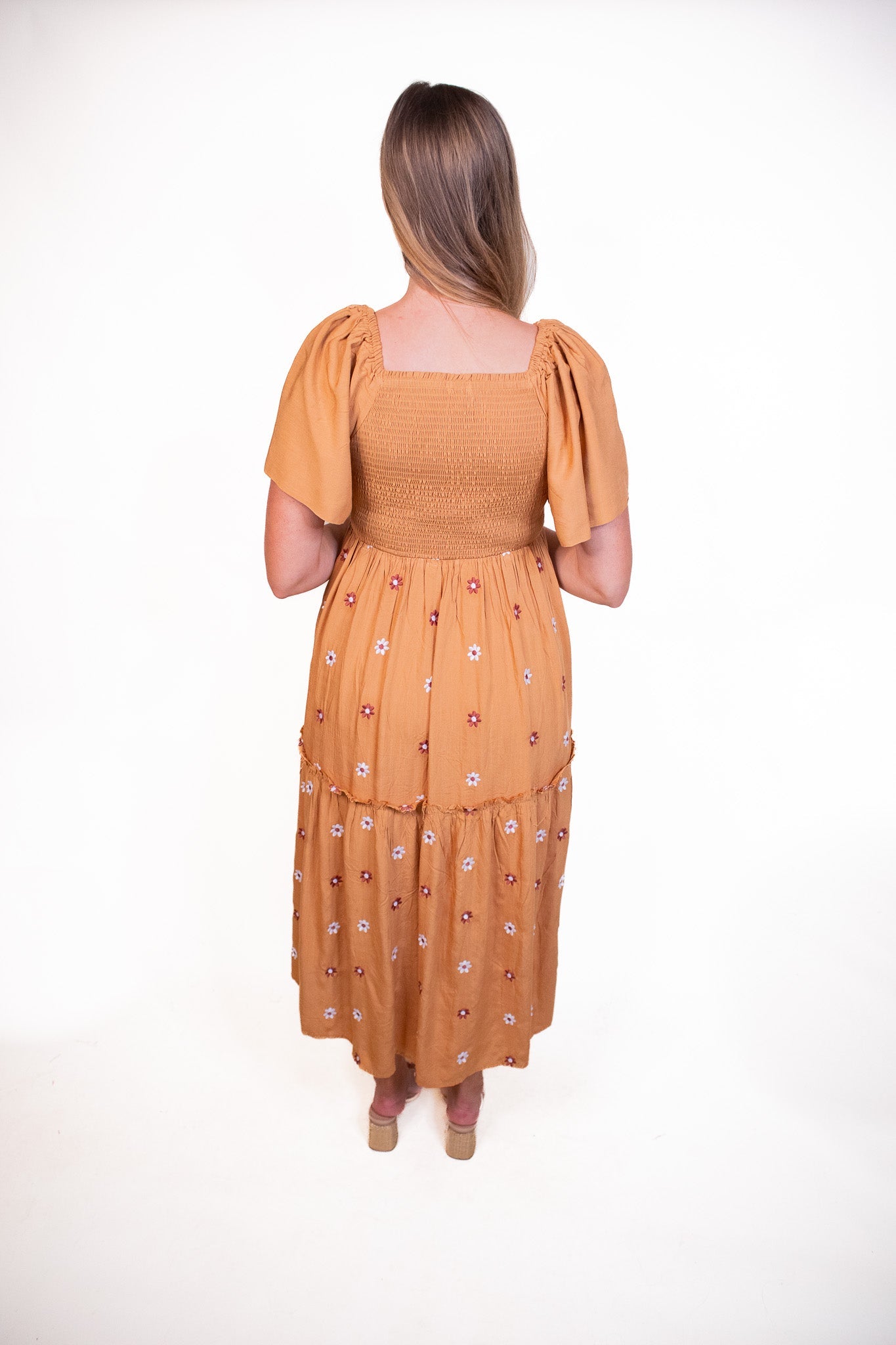 The Maya Smocked Embroidered Floral Dress in Rust