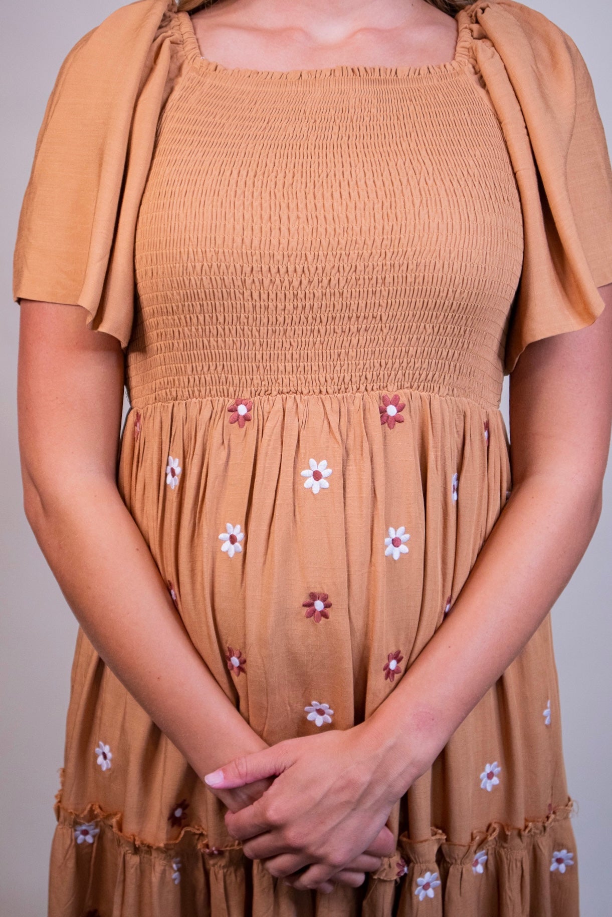 The Maya Smocked Embroidered Floral Dress in Rust