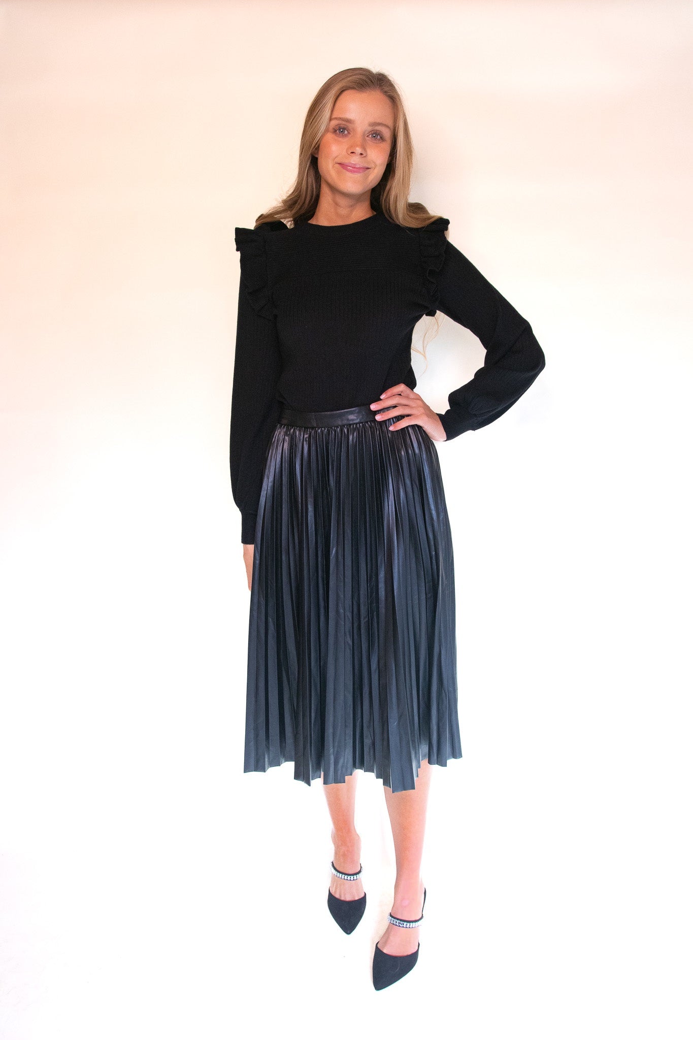 The Zoe Ruffle Shoulder Sweater in Black