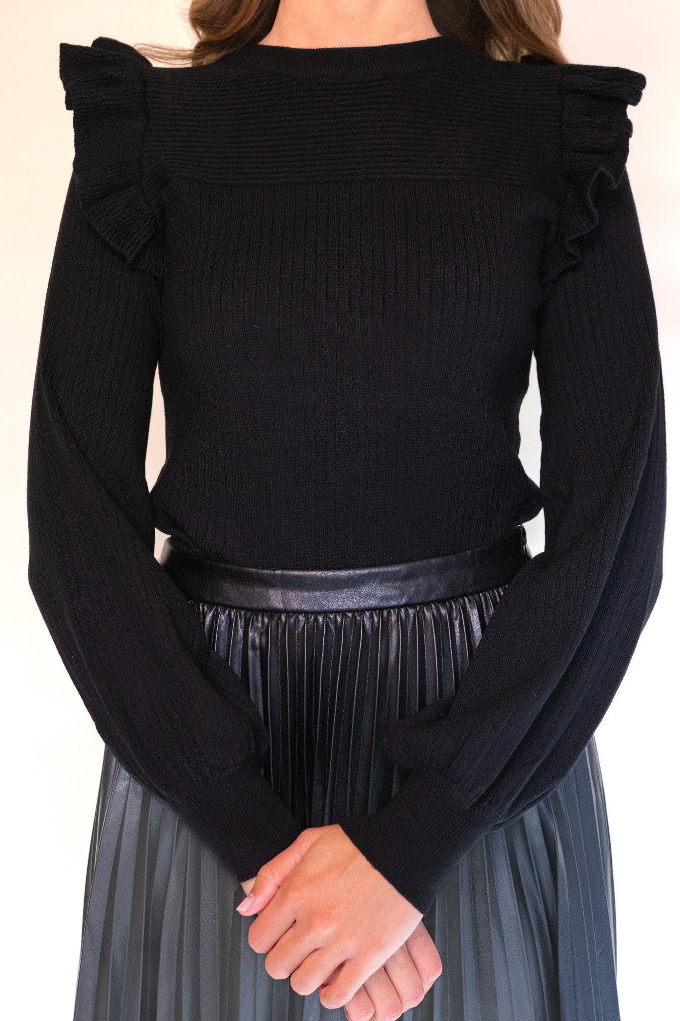 The Zoe Ruffle Shoulder Sweater in Black