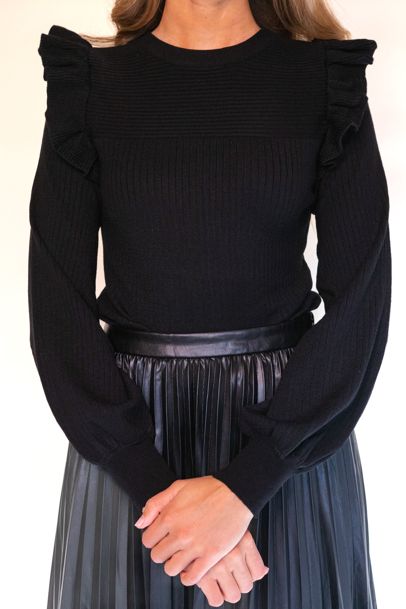 The Zoe Ruffle Shoulder Sweater in Black